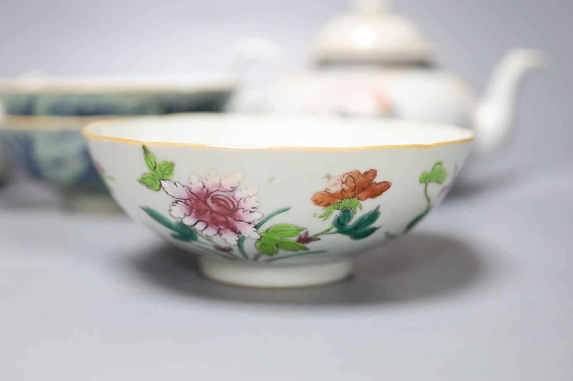 A Chinese famille rose teapot and sucrier, a 19th century Chinese bowl and a pair of blue and white bowls